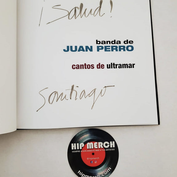Fotografía de la página interior del libro Cantos De Ultramar mostrando la firma manuscrita auténtica de Santiago Auserón (Juan Perro).