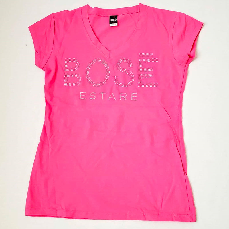 Fotografía de catálogo de la playera rosa oficial de Miguel Bosé con corte para mujer, resaltando el color y el diseño del estampado.