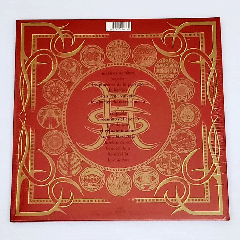 Fotografía de la contraportada del álbum El Espíritu del Vino de Héroes del Silencio en color rojo con ornamentación geométrica dorada y el listado de canciones oficial.