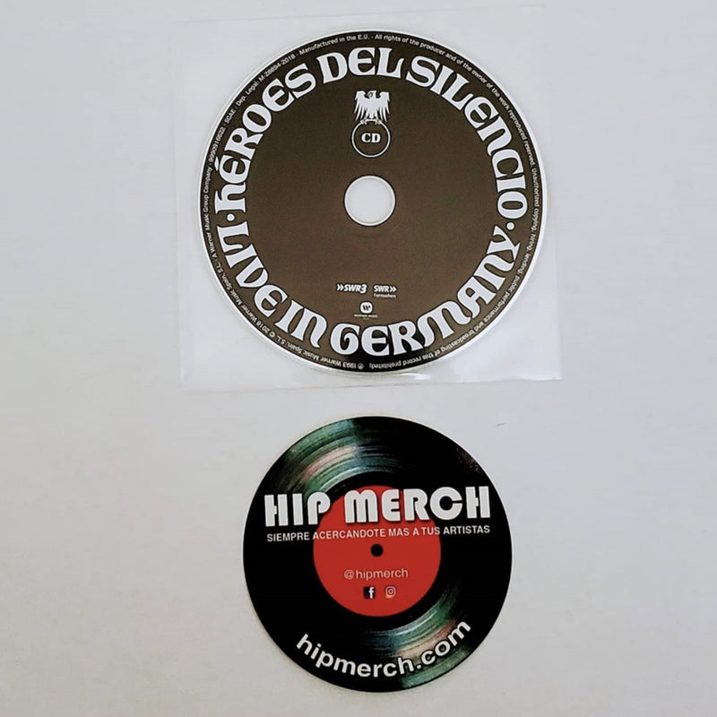 Fotografía del inserto impreso circular de colección que recrea el diseño central de las etiquetas oficiales de los discos de esta edición.